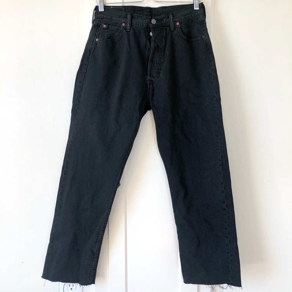 Black Levi’s jeans frayed